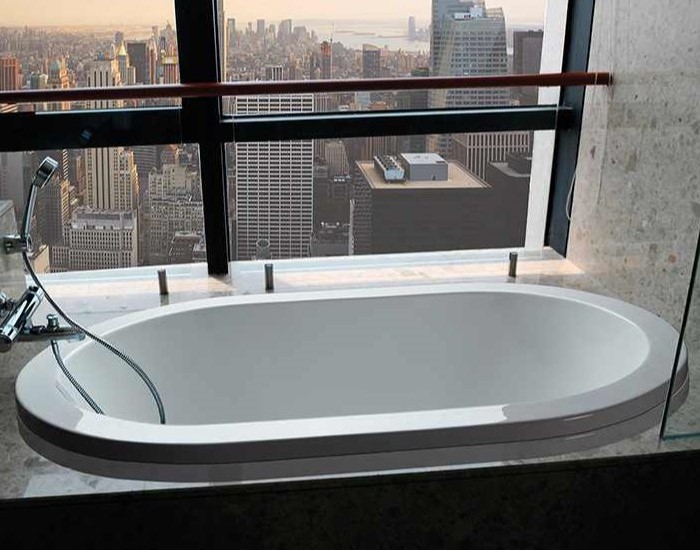 New Yorker shown as a drop-in soaking tub with a wall mounted tub filler
