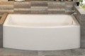Mezzaluna alcove bath with curved skirt installed between two knee walls