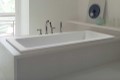 Andrea 8 Bathtub Installed as a Drop-in in a Freestanding Surround