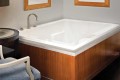 Andrea 9 Bathtub Installed as a Drop-in in a Corner Surround
