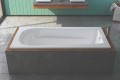 Barrington Drop-in Soaker Tub Installed in a Freestanding Wood & Tile Surround