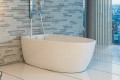Contura 3 Soaker Tub Installed with Drain Side Against the Wall, with a Wall Mount Tub Filler