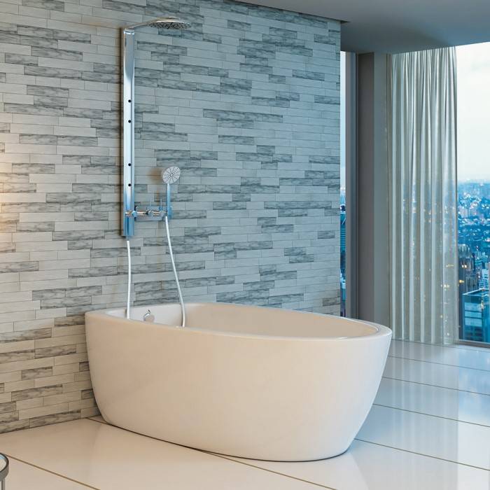 Contura 3 Soaker Tub Installed with Drain Side Against the Wall, with a Wall Mount Tub Filler