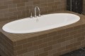Esmeralda installed as a drop-in tub with deck mounted tub faucet, Center Drain