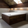 Alexis Bathtub Installed as a Drop-in in a Wood Surround