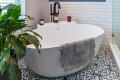 Tub Shown with Freestanding Faucet and Tub Shelf used for Storange