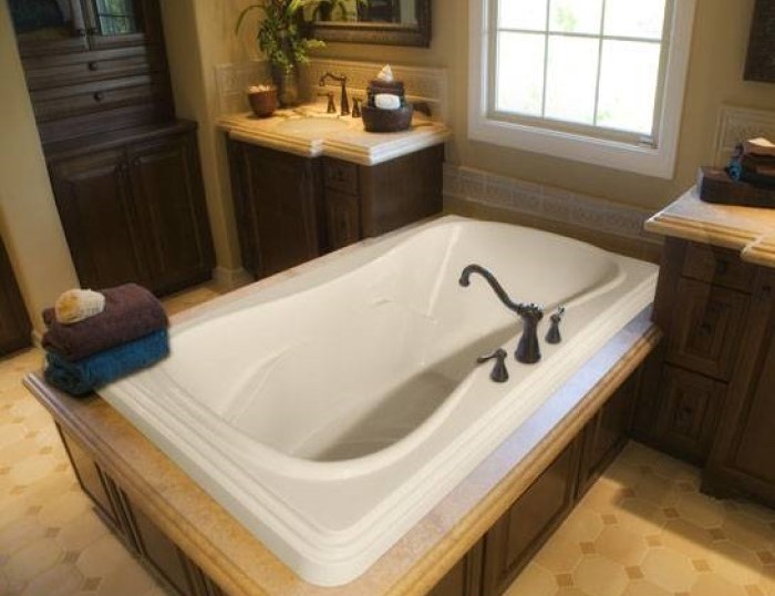 Jennifer Drop-in Bathtub Installed in a Tile and Wood Surround