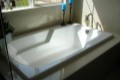 Solo Soaking Bath Installed as a Drop-in Tub, Modern Armrests