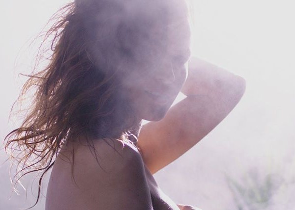 Woman Enjoying a Steam Shower