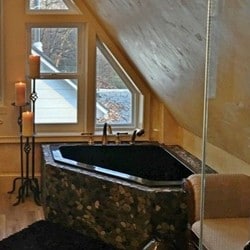 Black Corner Tub with Rock Tile