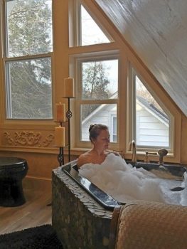 Black Corner Bathtub with Rock Tile