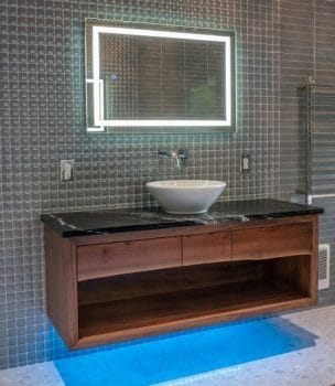 Wood wall vanity, stone top and vessel sink