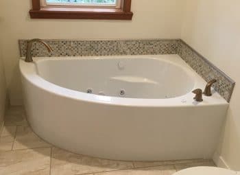 Corner Bath with Curving Front Skirt