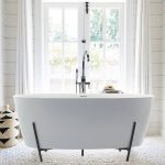 Solid Surface Freestanding Bath in a Metal Cradle