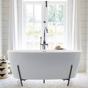 Freestanding tub is nestled in a hand-made steel cradle